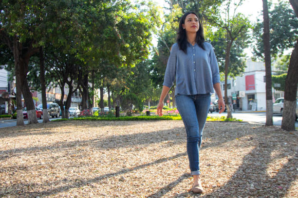 istock Woman walking in the park 1312971911