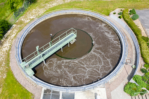 The primary clarifier aerial close-up view at the wastewater treatment plant.