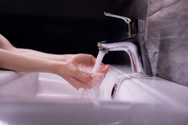 istock Clean kid hands by washing hands with soap 1312978148