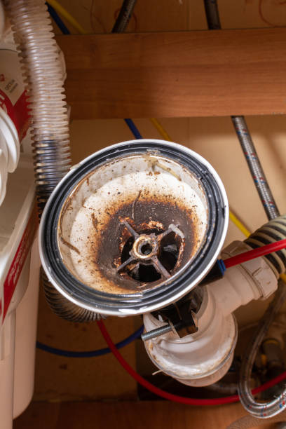 istock Broken sink in the kitchen. Clogged sink drain. Plumbing services. Drain and osmotic water filtration system. 1312980210