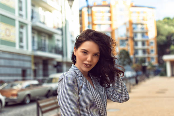 Walking with a brunette in a summer city