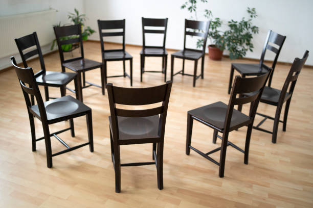A circle of empty chairs A circle of empty chairs in a plain room with a wooden floor alcoholics anonymous photos stock pictures, royalty-free photos & images