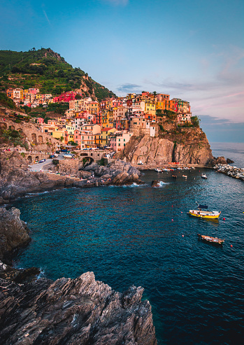 Manarola village on cliff rocks and sea at sunset., Seascape in Five lands, Cinque Terre National Park, Liguria Italy Europe.