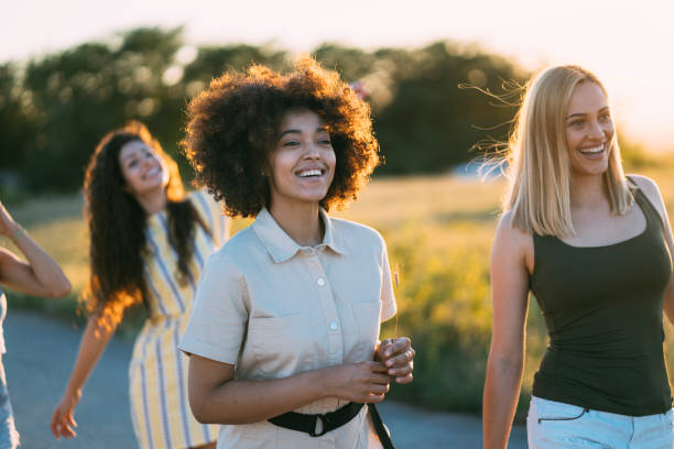 istock Girls walking outdoors at sunset 1312981658