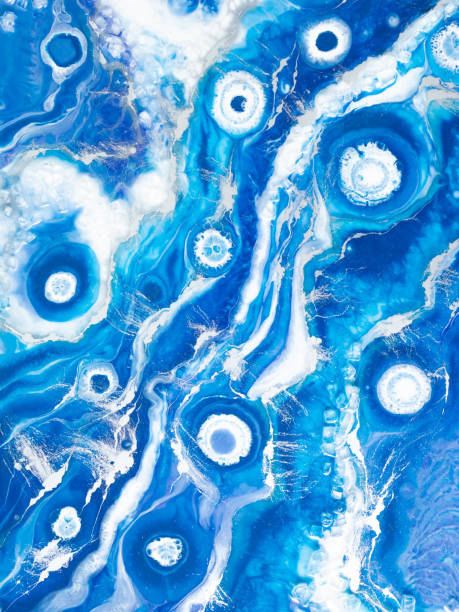 istock Epoxy resin art. Abstract composition. Resin art with blue and white colors 1312982795