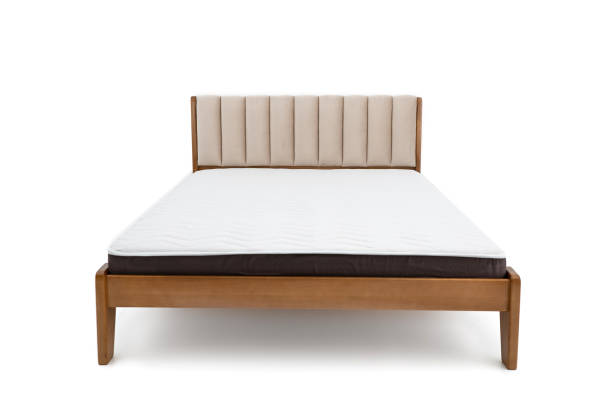 istock brown wooden double bed with mattress isolated on white background 1312983619