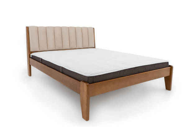 istock brown wooden double bed with mattress isolated on white background 1312983654