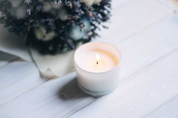 istock Candle and lavender on white wooden background 1312985509
