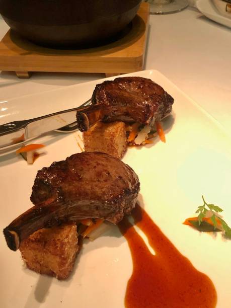 Fine dining, lamb racks served in restaurant with one Michelin Star