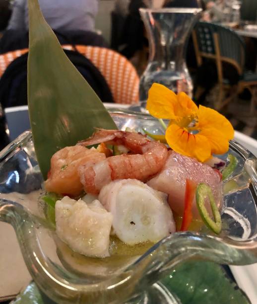 istock Ceviche with prawns, octopus, tuna, salmon and white fish decorated with a flower 1312988167