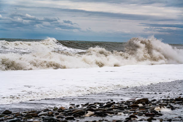 istock White waves, sea horizon and cloudy sky with clouds 1312989964