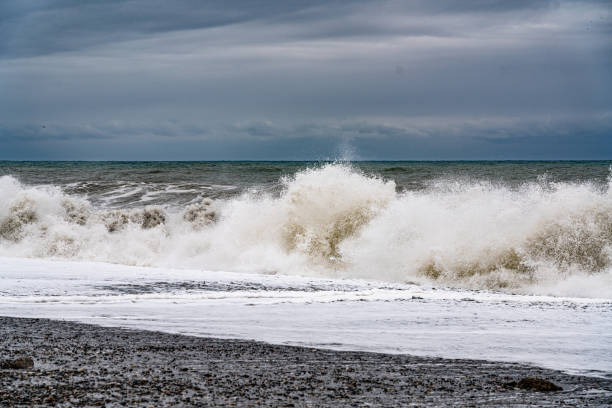 istock White waves, sea horizon and cloudy sky with clouds 1312990041