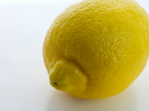 Macro still-life photography of partial yellow lemon for background image with copy space for texts