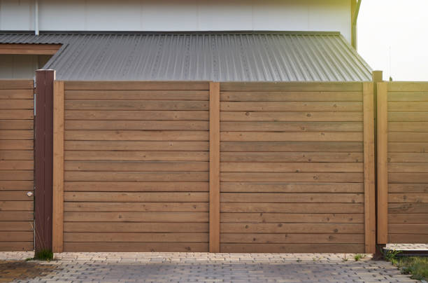 istock Brown wooden gate and fence 1312992156