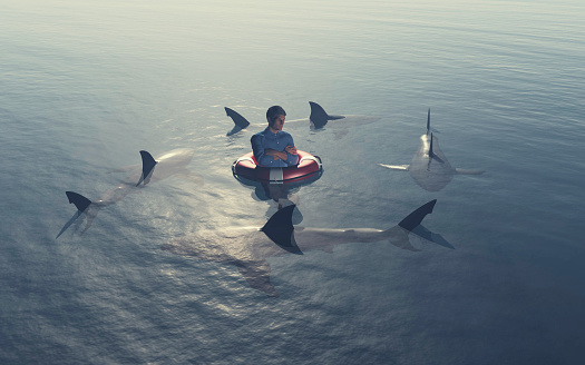 Man surrounded by sharks in the ocean . This is a 3d render illustration .