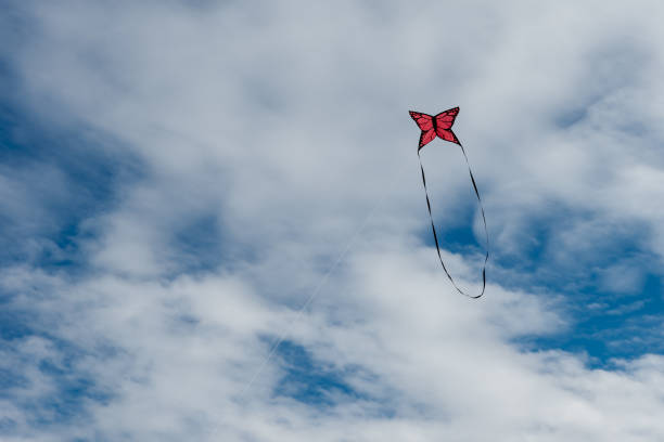 istock Colorful Kites flying over the sky 1312993306