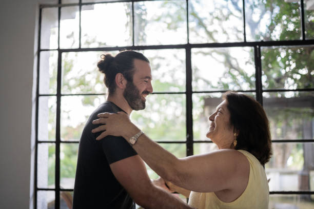 istock Mother and son dancing at home 1312993426