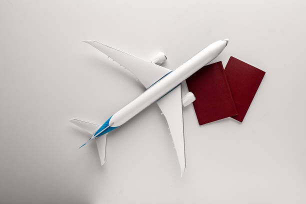 istock Travel concept with airplane toy over white background. Top view flat lay with copy space 1312995923