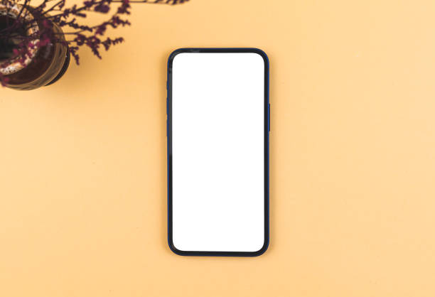 istock Mockup smartphone still life background, blank white screen with copy space, vintage and retro minimal workspace concept 1312997500