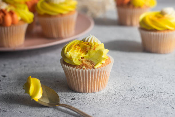istock Delicious muffins. Orange and lemon cream muffins 1312997825