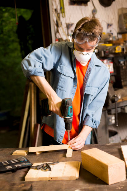 istock Young adult Caucasian male working in small workshop. 1312997959