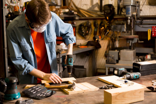 istock Young adult Caucasian male working in small workshop. 1312997969