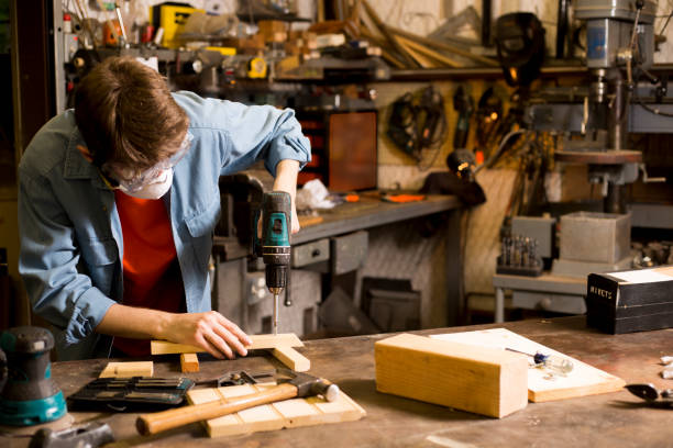 istock Young adult Caucasian male working in small workshop. 1312997971