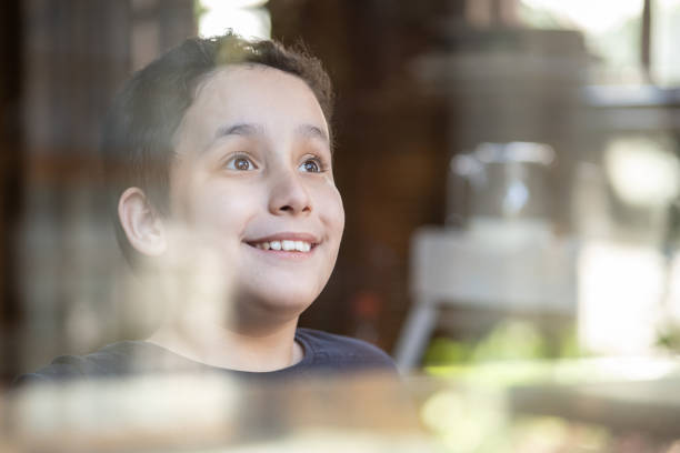 istock Boy contemplating at home 1313000307