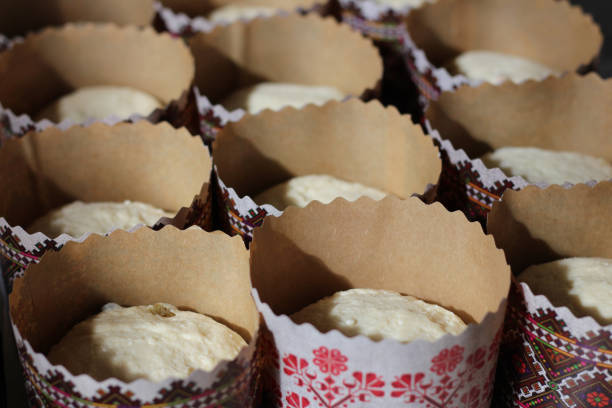istock Easter cake dough in paper tins ready for baking 1313001459