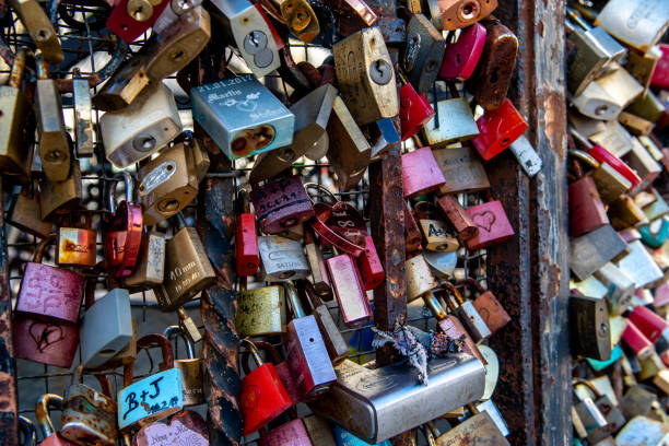 istock Colorful Love Padlocks Attached On Iron Fence 1313002337