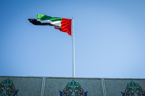 Historic Islamic floral design with UAE national flag in Abu Dhabi, Capital of United Arab Emirates.