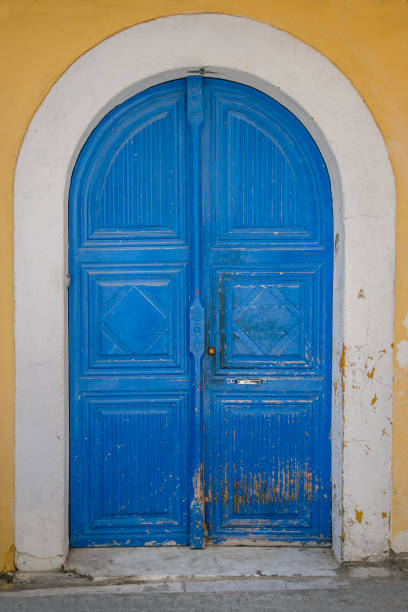 istock Old wooden doors, metal handles 1313009090