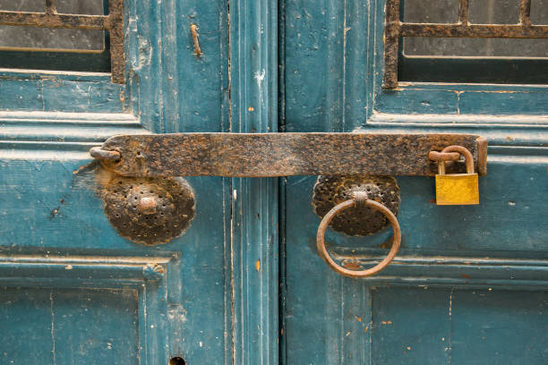 istock Old wooden doors, metal handles 1313009157