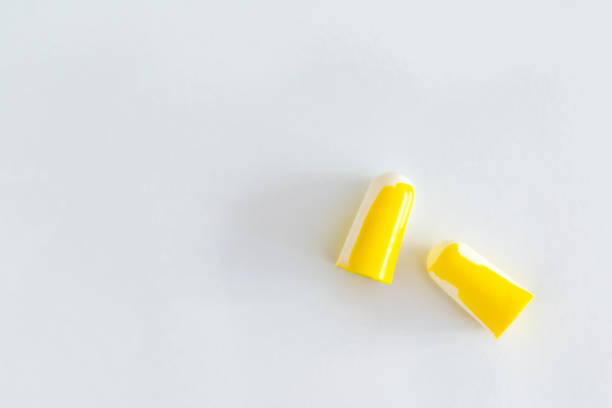 istock Pair of soft foam ear plugs on white background, close-up 1313009170