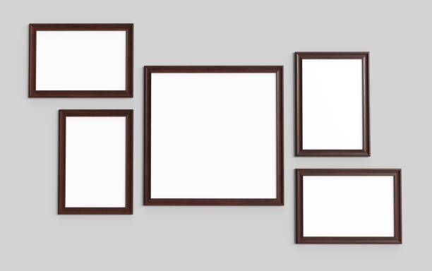 Picture frames on grey wall mockup stock photo