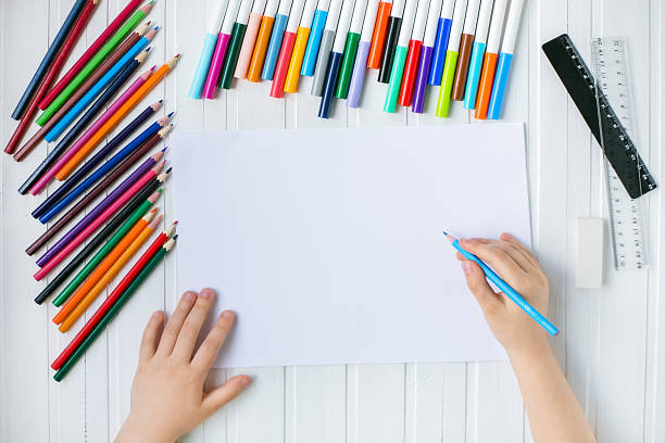 istock The child's hands are painted with colored pencils 1313010260