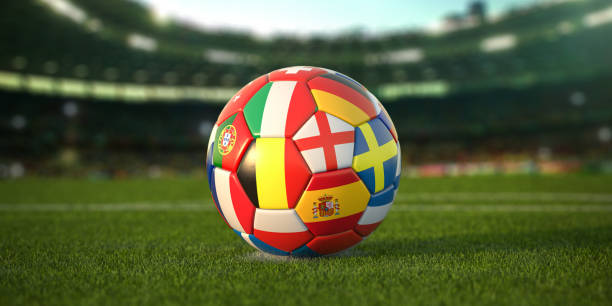 pallone da calcio con bandiere dei paesi europei sull'erba dello stadio di calcio. euro championship 2021. - inghilterra ucraina foto e immagini stock