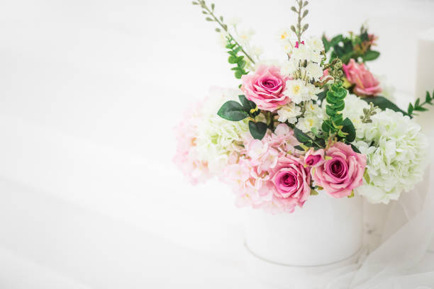 White beautiful background with a bouquet of flowers stock photo