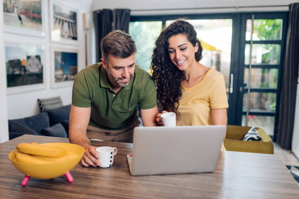 istock Man and his wife working from home and drinking coffee 1313018338