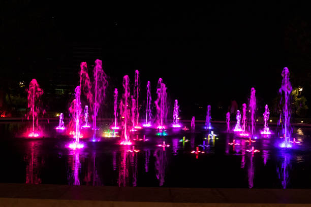 istock Bright colourful fountain against a dark sky 1313018919