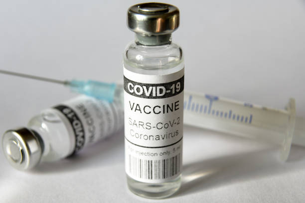 istock Coronavirus vaccine vials on white background 1313021538