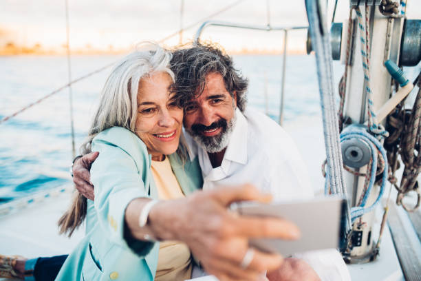 istock Seniors taking a selfie while sailing with their yacht 1313029850
