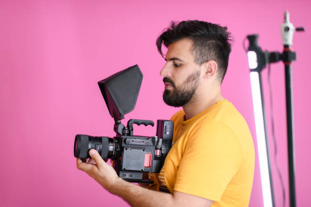 istock cameraman with professional equipment shoots video clips 1313047737
