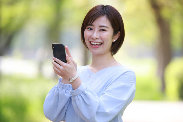 istock Female employee operating a smartphone 1313049348