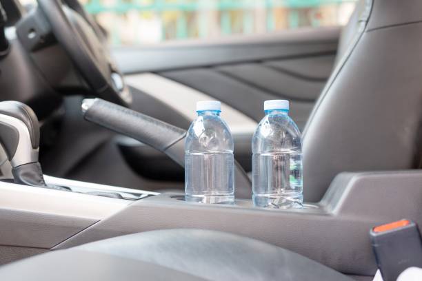 istock Drinking water in the car prepared for traveling 1313057687