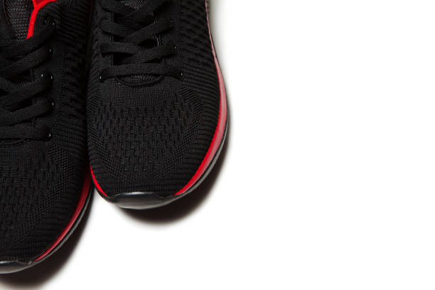 istock Sport black sneakers isolated on white background 1313058522