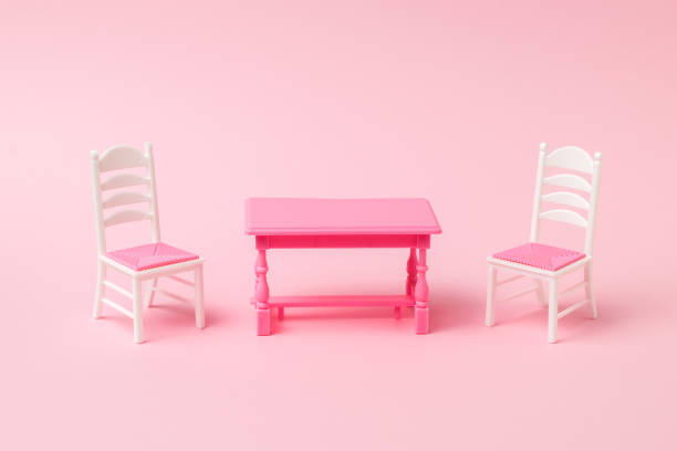 istock Red table with two chairs on a pink background. 1313058633