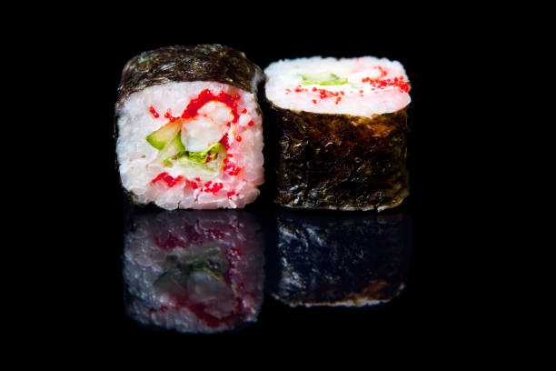 istock Traditional fresh japanese sushi rolls on a black background 1313060954