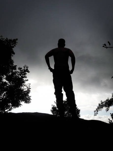 istock boy back light shot in deep green forests feeling the true nature 1313062116
