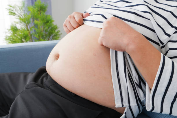 istock An obese man who eats too much 1313062963
